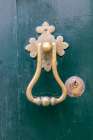 Angra do Heroismo, Terceira Island, Azores, Portugal. An old brass door knocker on a green door. Art Print